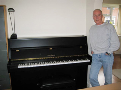 Allan at home with his Schimmel piano